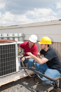 two-techs-working-on-HVAC-system