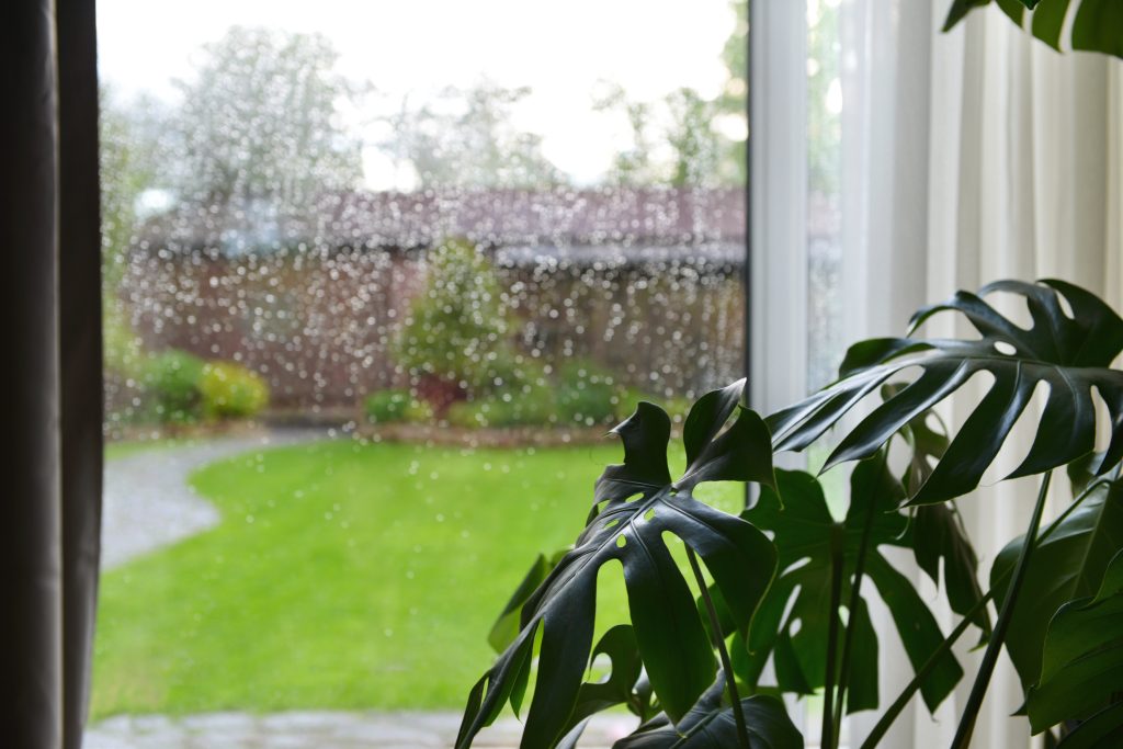 Heavy rain and humid weather conditions affecting residential HVAC system performance in Orlando Florida for English Air.